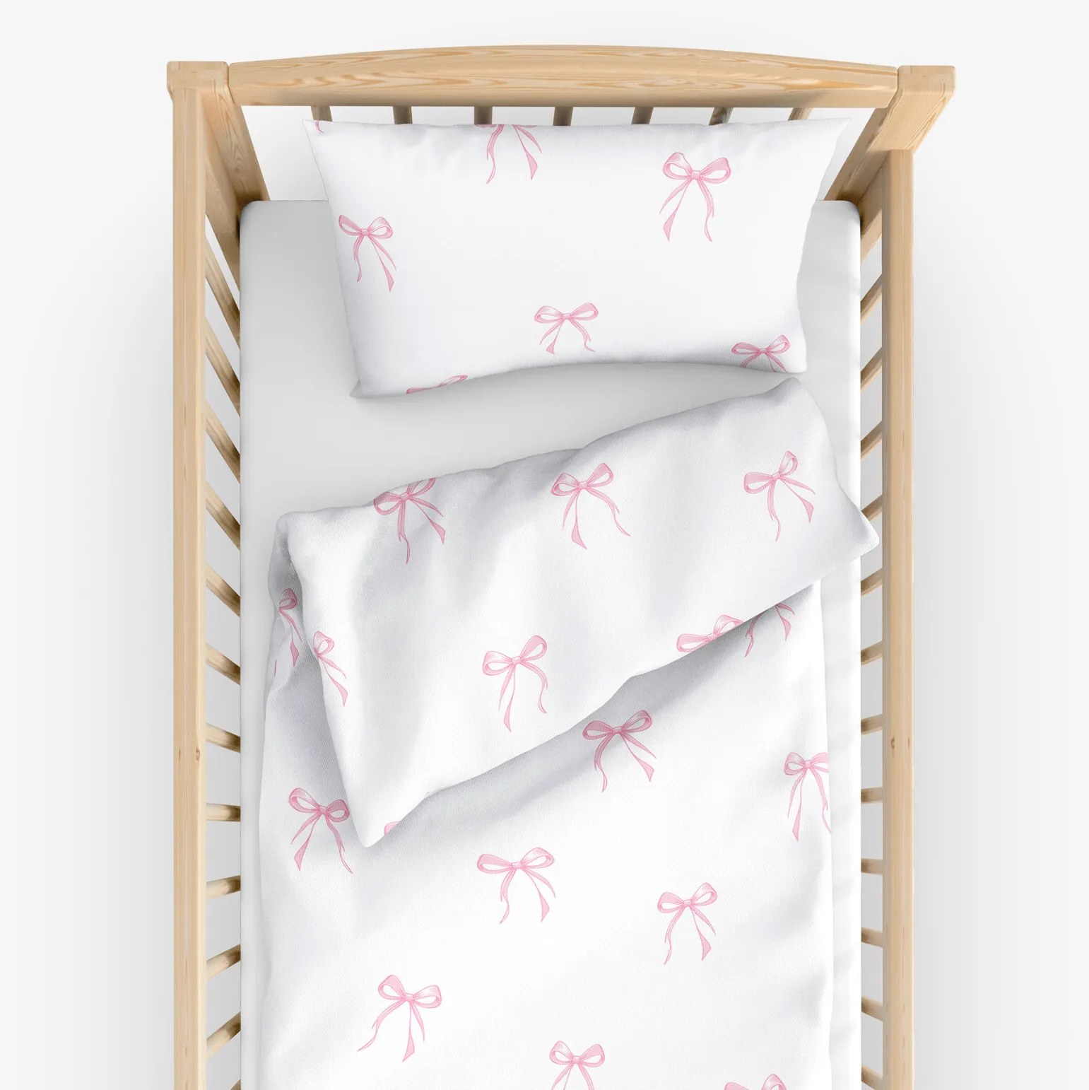 Goldea detské bavlnené obliečky do postieľky - ružové mašličky 90 x 120 a 40 x 60 cm
