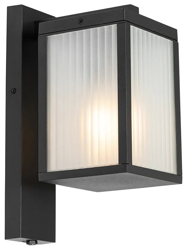 Vonkajšia nástenná lampa čierna s rebrovaným sklom a senzorom súmraku - Charlois